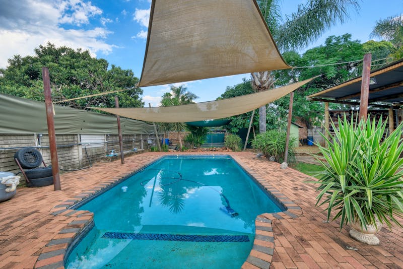 an irregularly-shaped swimming pool